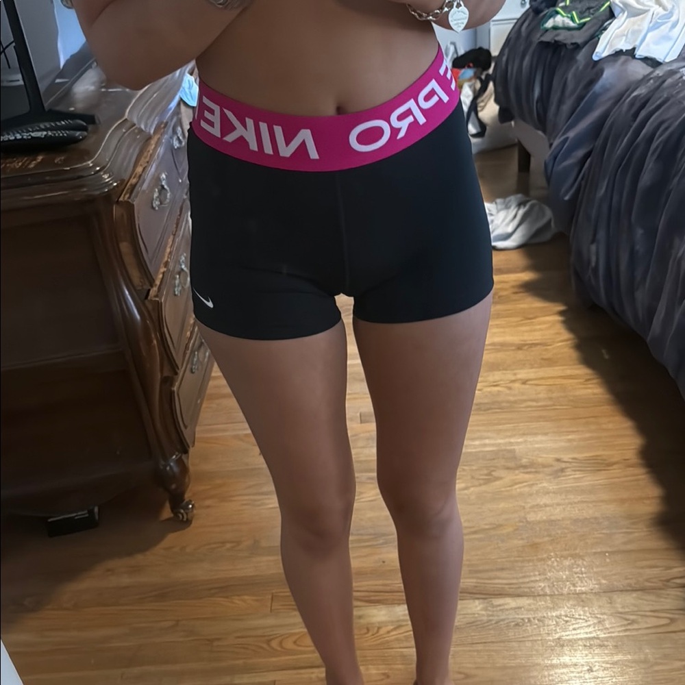 Nike Black and Pink Athletic Shorts for Performance